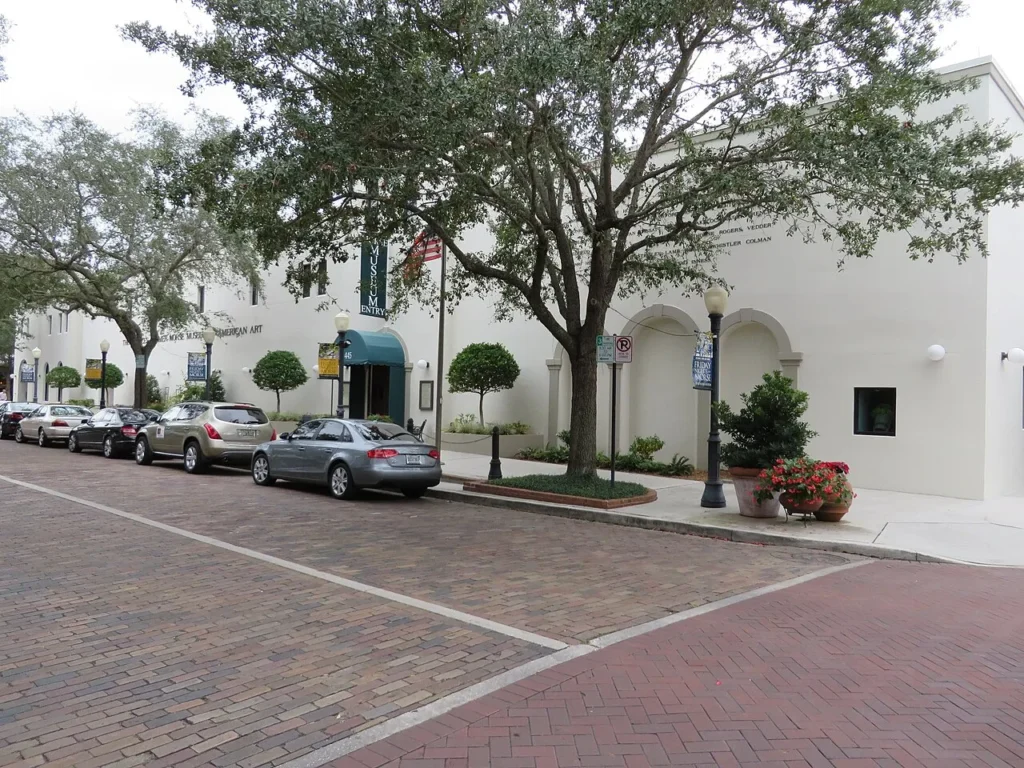 White facade and green entry awning of the Morse Museum on Park Avenue, Winter Park